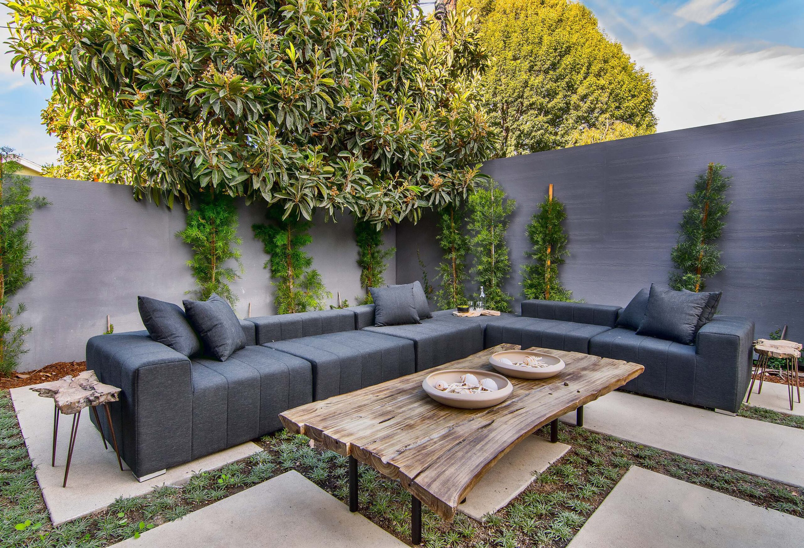 Outdoor lounge area in backyard of modern California home