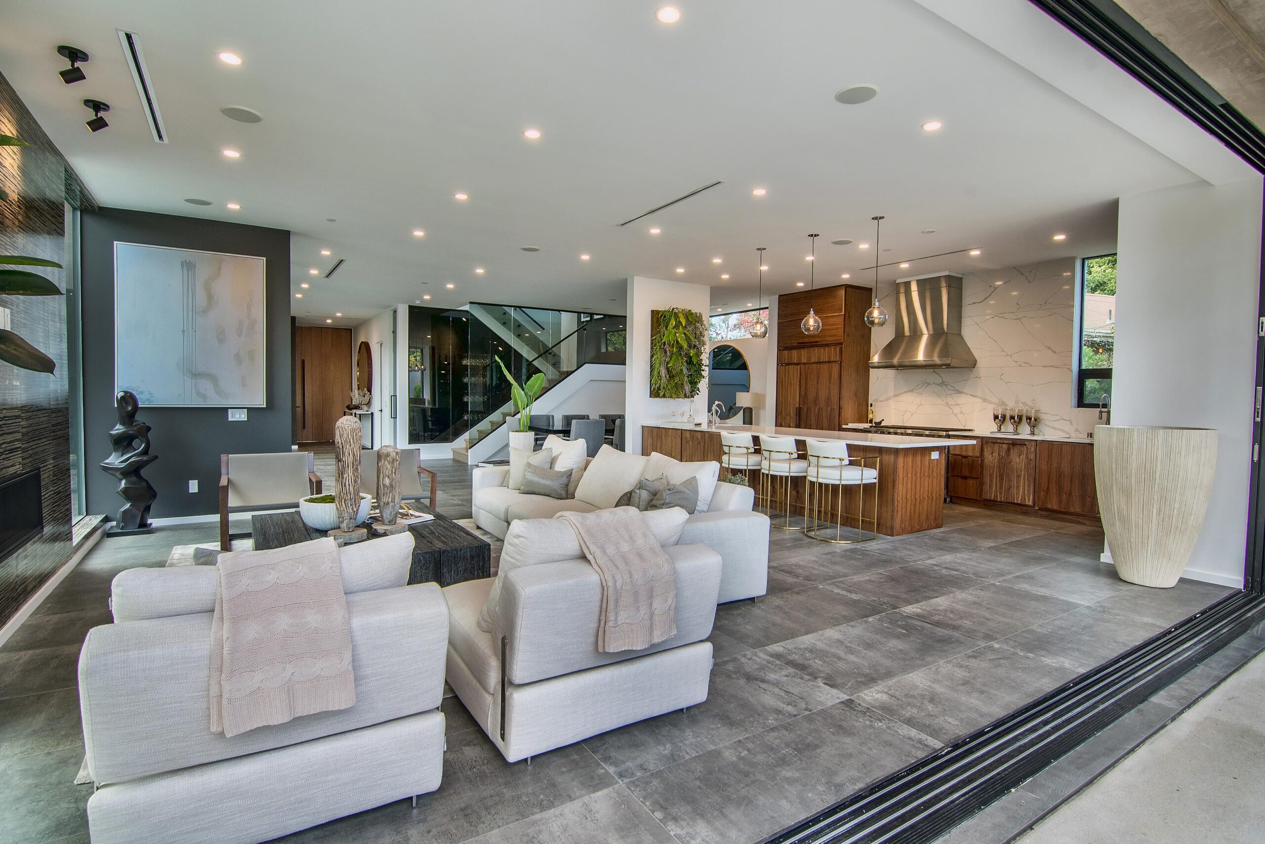 Expansive kitchen featuring elegant tile backdrop