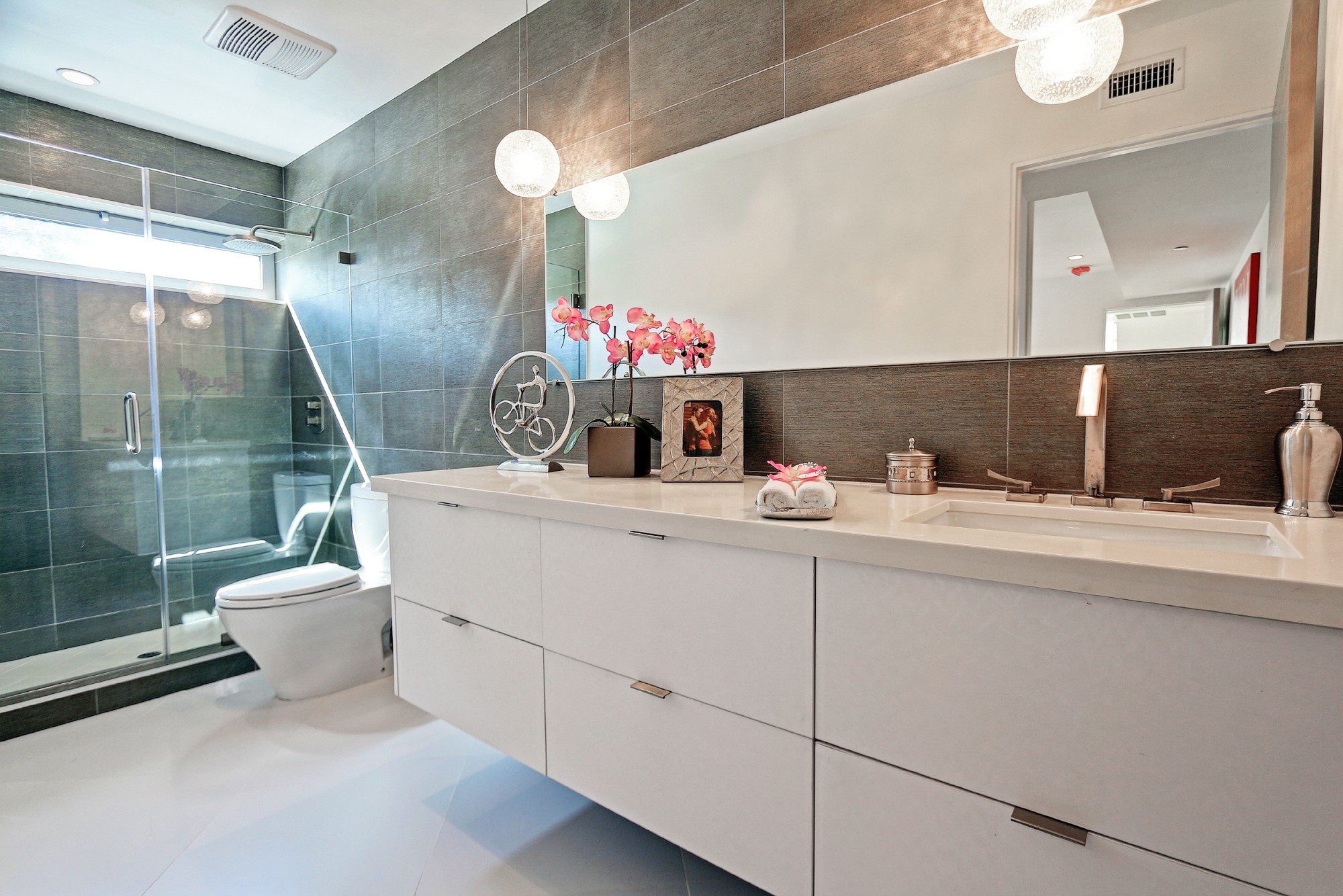 Minimalistic style bathroom featured in modern Beach City home