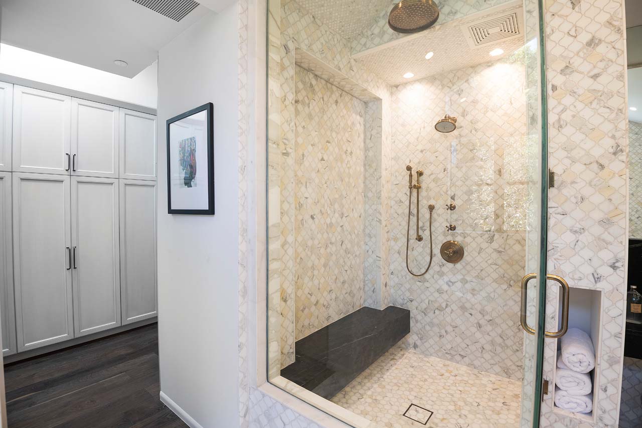 Large shower with built in bench in modern California home