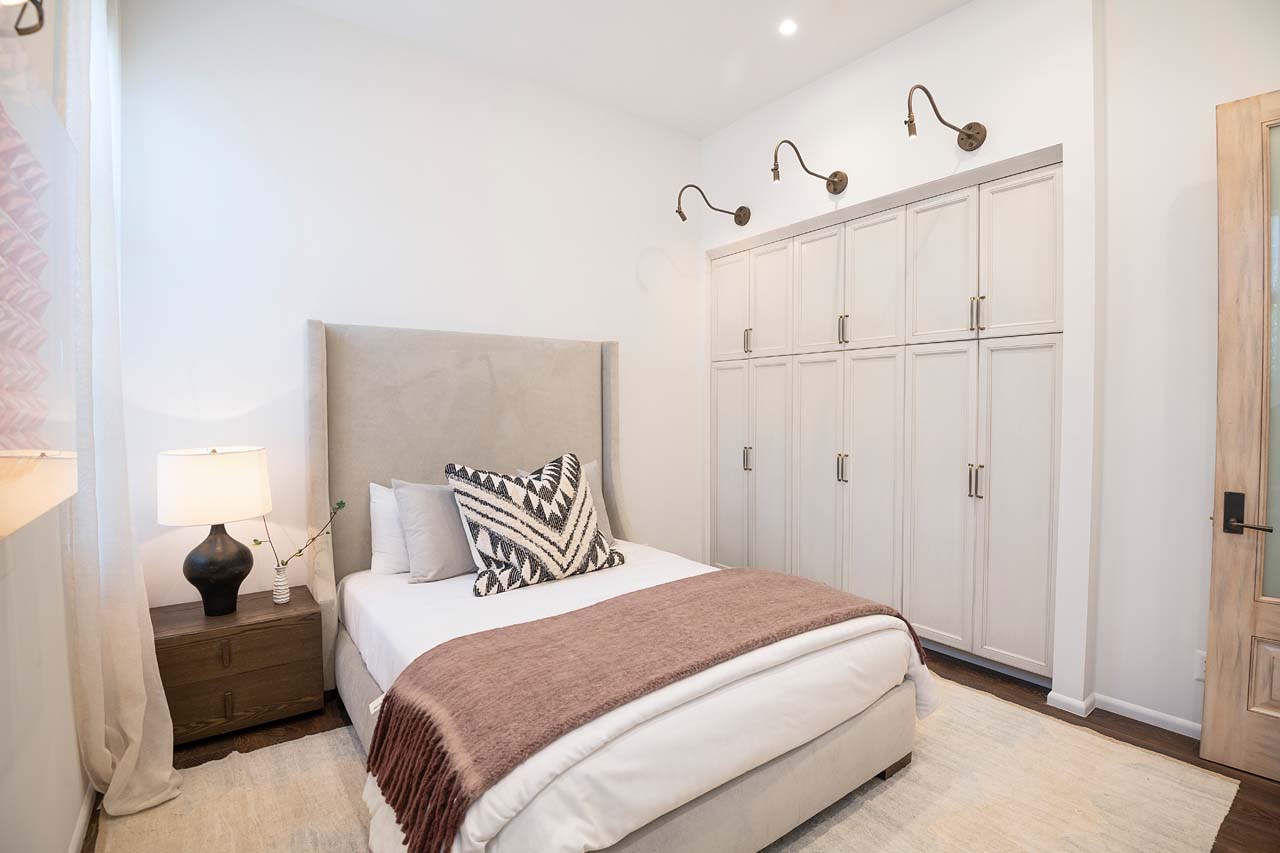 Minimalist style bedroom with three closets
